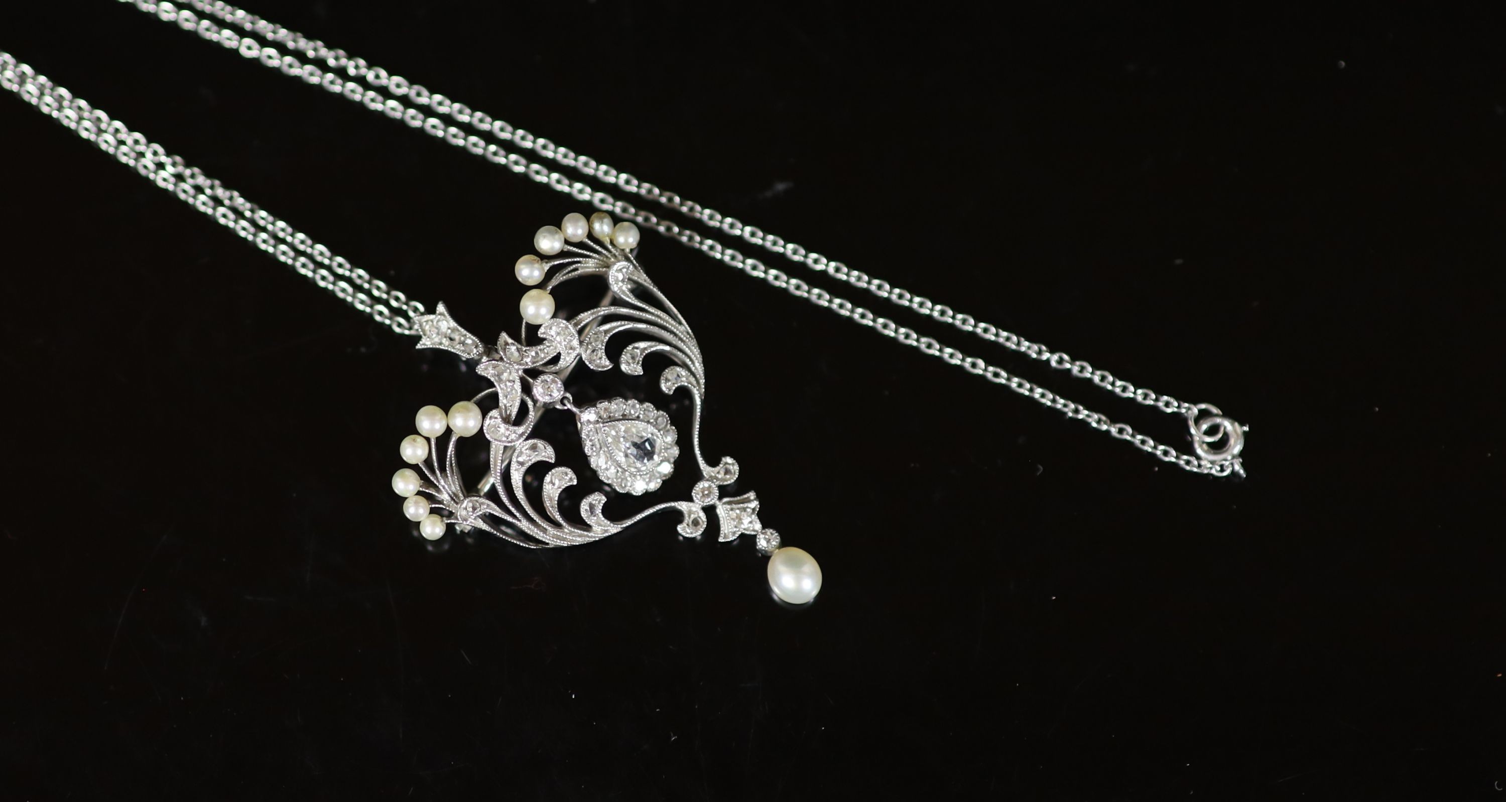 A 1920's style platinum, round and rose cut diamond and cultured pearl set drop pendant necklace